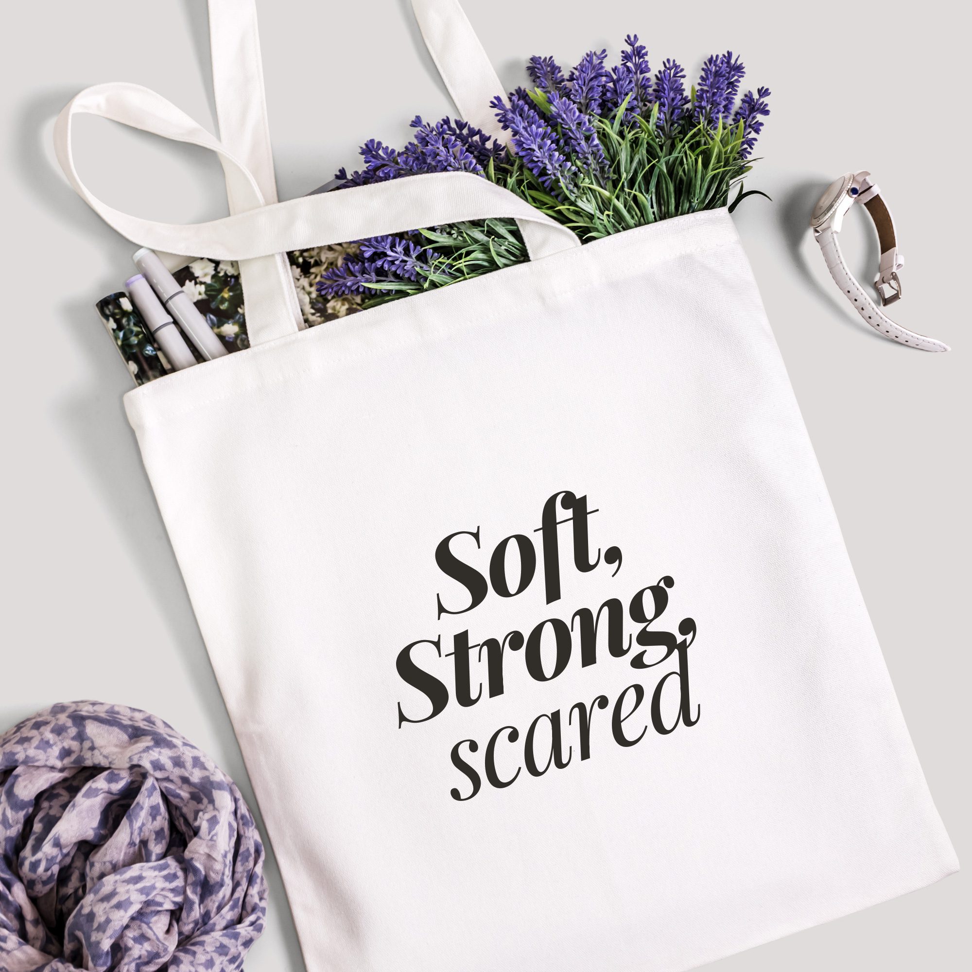 Canvas Tote Bag – Soft Strong Scared Emotional Flatlay18 White canvas tote bag with “Soft, Strong, scared” surrounded by lavender, notebook, and scarf