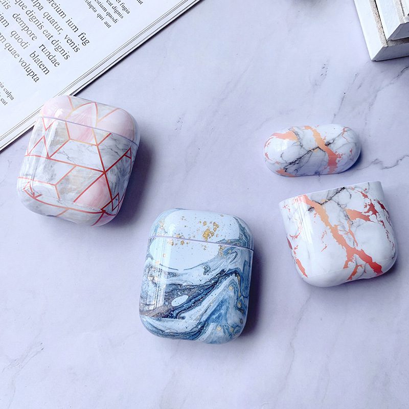 Designer Marble AirPods Cases – Luxury White Marble Collection Luxury White Marble AirPods Case collection featuring geometric and marble designs in pink, blue, and orange tones.