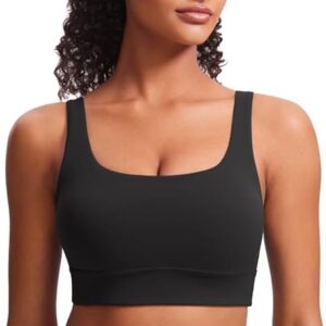 Model wearing Butterluxe Sports Bra in black, showcasing scoop neckline, wide straps, and seamless fit