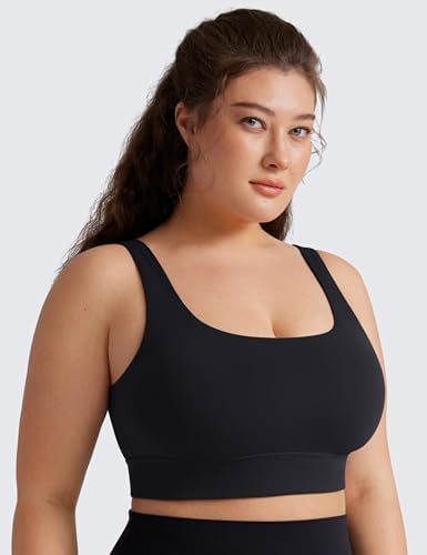Butterluxe Sports Bra – Sleek Fit & Everyday Support Model wearing Butterluxe Sports Bra in black, featuring scoop neckline and wide straps, posed against light gray background
