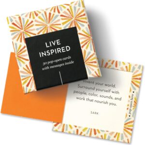 Box of Affirmation Cards for Women with colorful starburst design, partially opened to reveal a motivational quote card inside