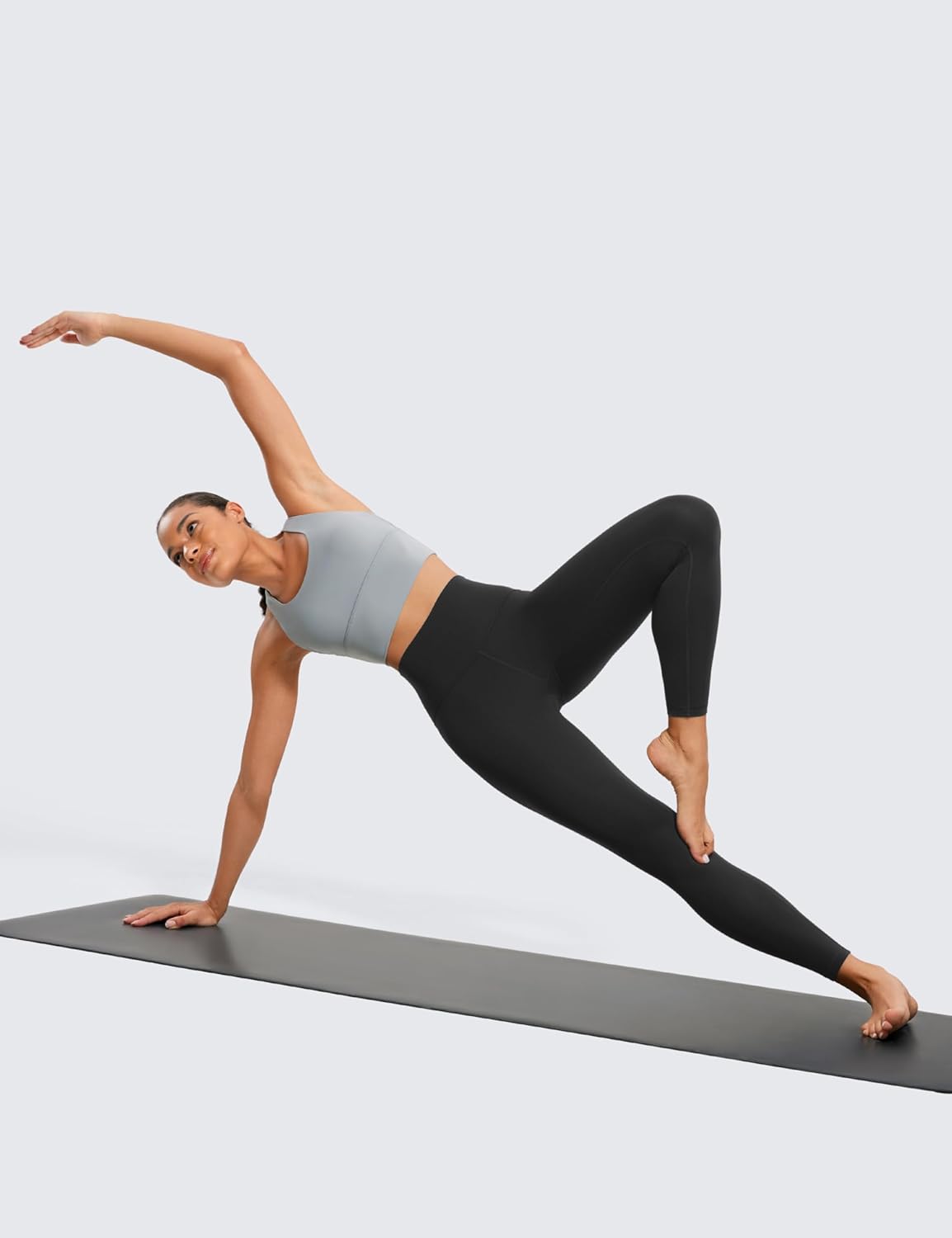 Butterluxe High-Waisted Leggings – Flexible Fit for Yoga & Active Movement Woman performing yoga pose in Butterluxe High-Waisted Leggings and sports bra, showcasing flexibility and fit on black yoga mat