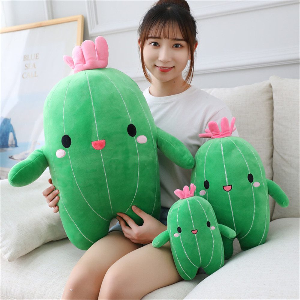Cactus Plush Toy – Happy Trio Set Three cactus plush toys in small, medium, and large sizes with pink flowers and smiling faces.