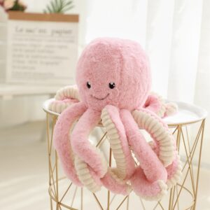 Pink octopus stuffed animal plushie with cream-striped tentacles on a gold wire stool.