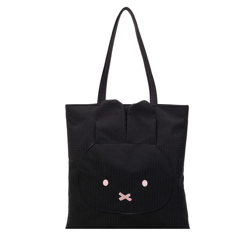 Black Miffy Rabbit Tote Bag – Cute with a Twist Black Miffy rabbit tote bag with pink cheeks, black eyes, and "X" mouth.